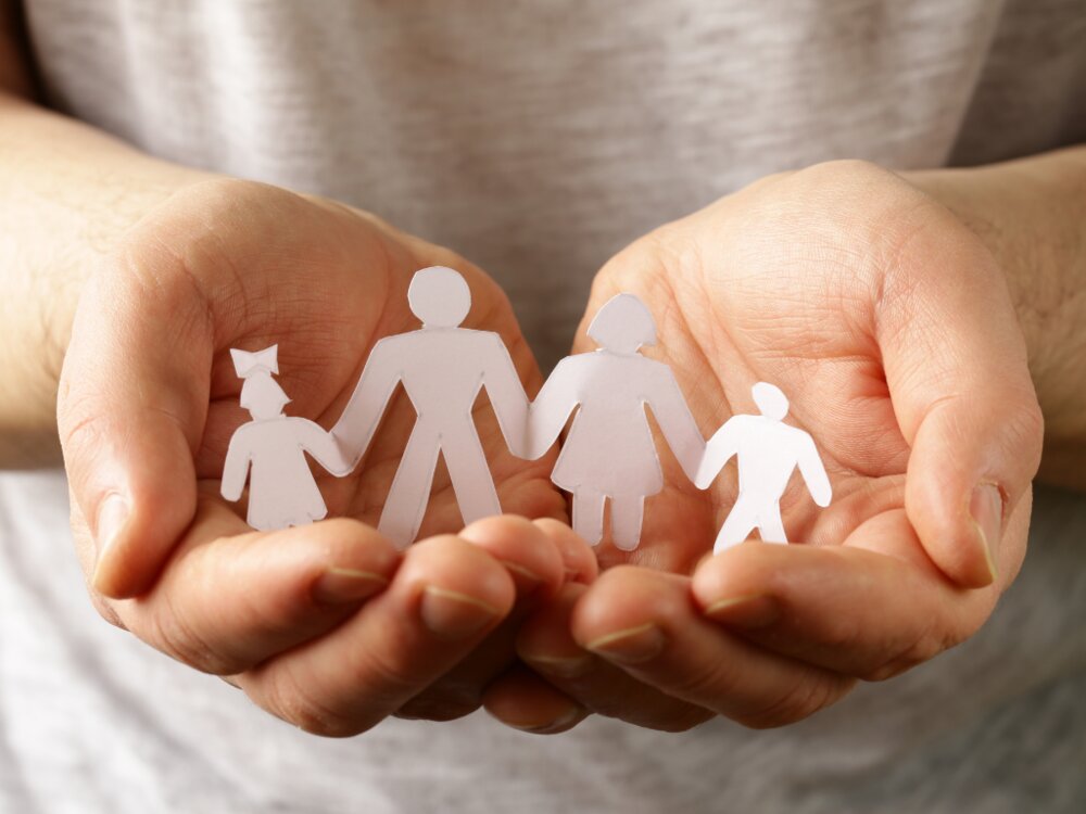 Paper cut out of family