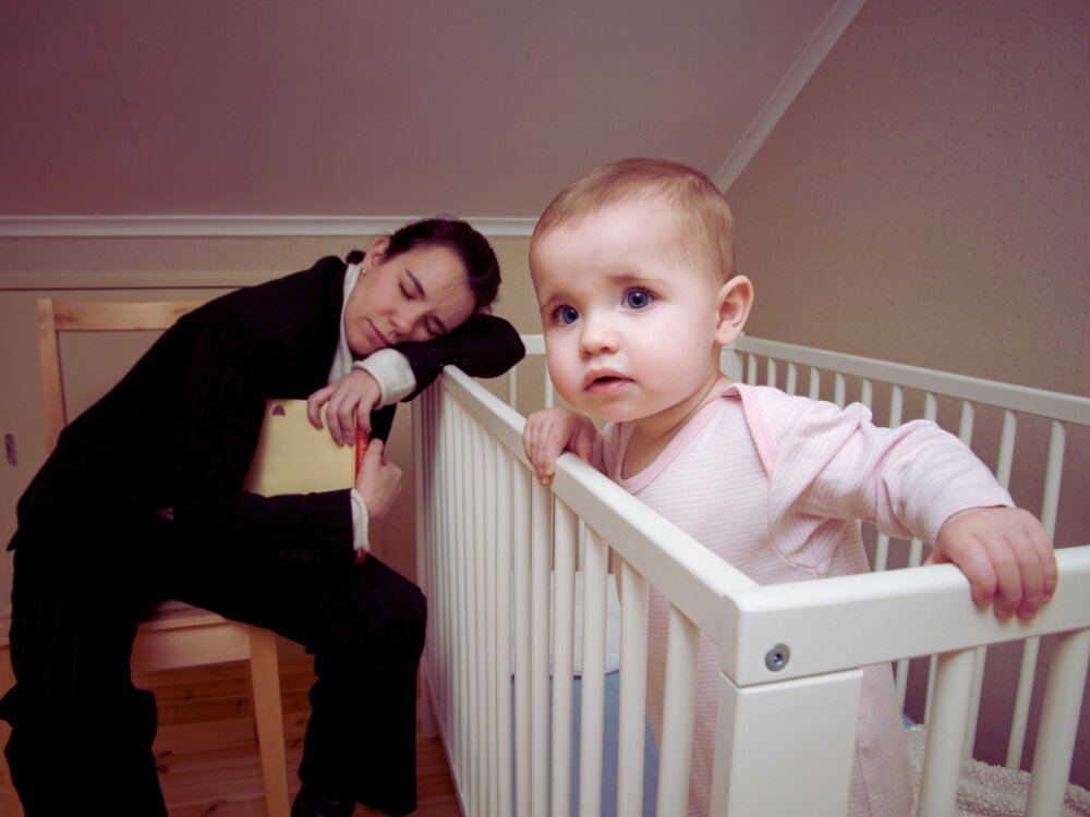 Tired parent with child