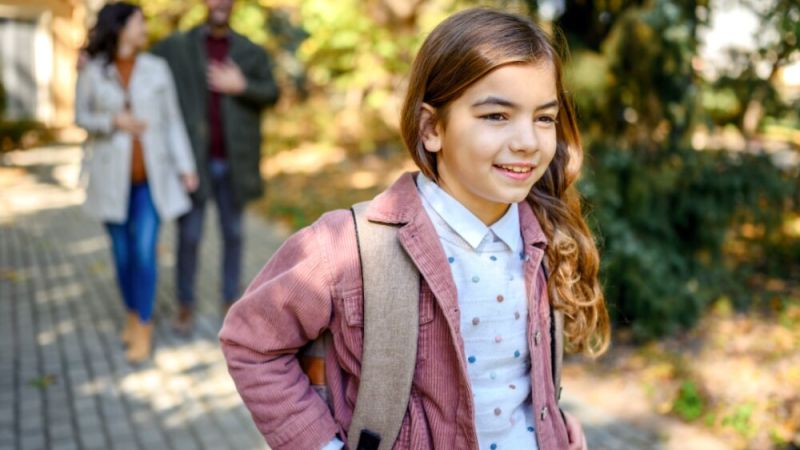 Girl with backpack on