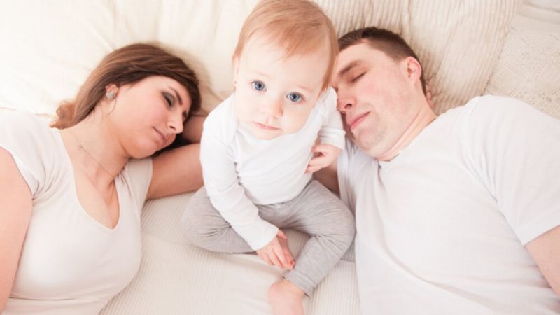 Young family in bed