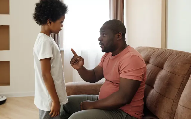 Dad telling off his son