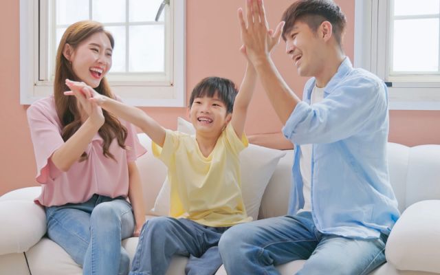Parents encouraging child