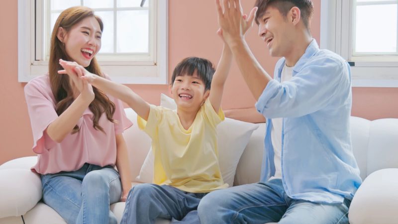 Parents encouraging child