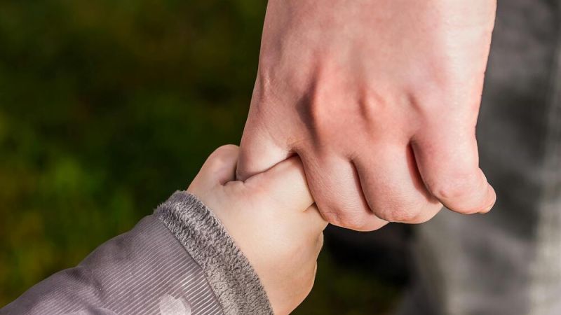 Holding childs hand