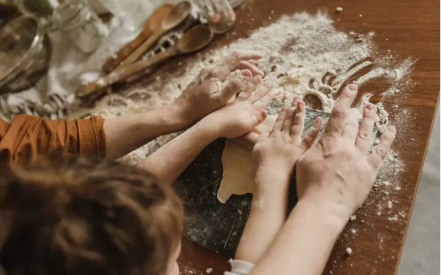 Parent and child baking together