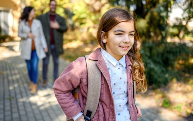 Girl with backpack on