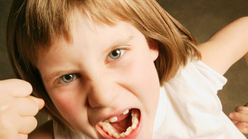 Angry child with fist up