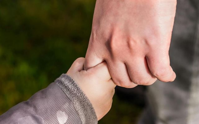 Holding childs hand